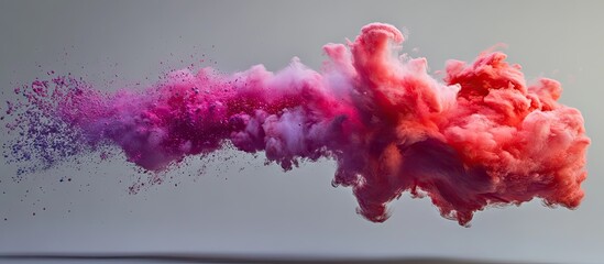 Fototapete - Color powder explosion in shades of pink and red against a soft grey background showcasing vibrant movement and dynamic cloud formation.