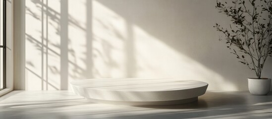 Aufkleber - Minimalist interior with a white oval platform on a light surface, soft shadow patterns on the wall, and a small potted plant in the corner.