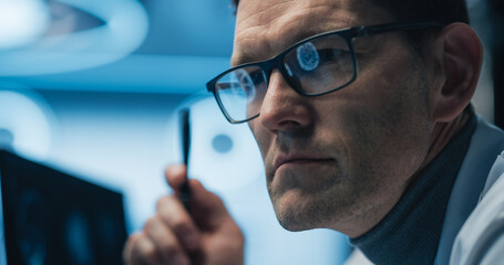 Aufkleber - Physician Examines Brain Scans on Computer Screen, Focusing on Healthcare Science and Medicine. Glasses Reflect Medical Images and Neurological Data. Close-up Portrait