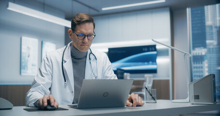 Aufkleber - Male Doctor in a High-tech Hospital Office Works on a Laptop, Analyzing Medical Data. the Modern Clinical Environment Highlights Advanced Healthcare, Research