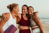 Friends enjoying a sunset yoga session on the beach embracing wellness