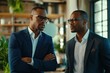 © Aleksandr - Two african adult males in business attire engaged in conversation
