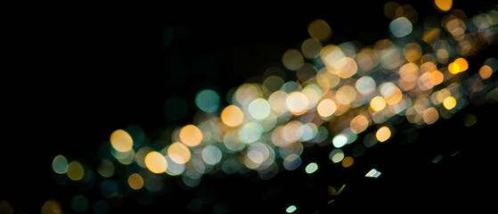 Poster - Modern light bokeh texture with triangular shapes and sharp angles on black background