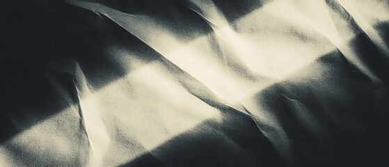 Poster - Light reflecting paper texture creating a subtle sheen against a dark background