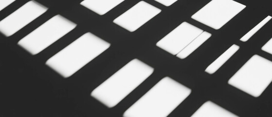 Poster - Shadows cast by window frames create geometric patterns against a dark background