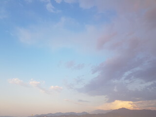 Wall Mural - pastel colour sky, dawn background. blue sky with clouds and sun light