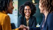 © yana_vinnikova - Women engaged in a professional meeting while shaking hands in a modern office setting