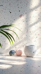 Poster - Soft pastel hues in a minimalist terrazzo texture set a calming atmosphere. Natural stones and a clay vessel sit gracefully, illuminated by dappling sunlight and peaceful shadows