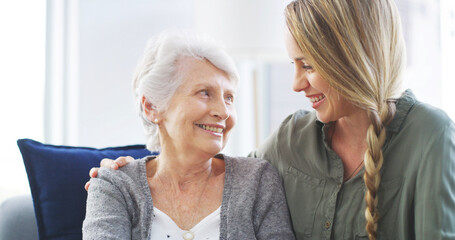 Wall Mural - Senior, woman and happy together with daughter on sofa for bonding, relationship and weekend visit in retirement. Love, people and smile in home with connection, support and relax for conversation