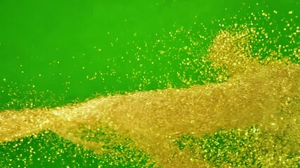 Wall Mural - Golden Glitter Explosion: A vibrant burst of golden glitter explodes against a bright green backdrop, creating a dynamic and dazzling visual effect.