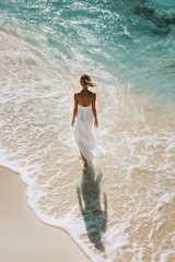 Wall Mural - Woman Walking on Beach