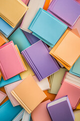 Aufkleber - A top-down view of various pastel-colored hardcover books scattered across a surface, representing creativity, knowledge, and the joy of reading in soft and inviting colors.