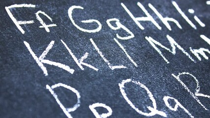 Fototapete - Letters of the English alphabet on the board written in chalk. English alphabet, animation.