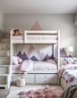 © dedy - Inviting children's bedroom featuring white bunk beds with playful mountain mural accent