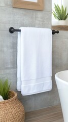 Wall Mural - A luxurious bathroom features a minimalist towel rack holding a soft towel. Natural light streams in, highlighting the stone surfaces and tranquil mountain views outside