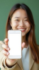 Poster - Smiling businesswoman showing smartphone with blank white screen
