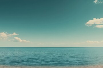 Wall Mural - Calm ocean view with clear blue sky and gentle clouds on a sunny day by the shore