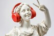 © Маргарита Вайс - close-up greek antique female sculpture in large red headphones showing victory sign on white background