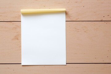 Poster - white sheet of paper with yellow sticky tape on wooden table creates a perfect background for messag