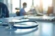 © Ilia K - Close-up of a stethoscope against the background of a modern hospital and doctors. Place for text