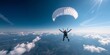 © Kate - A man is flying a parachute in the sky