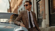 © Oksana - A stylish man in a tailored suit leans on a classic car, exuding elegance, confidence, and sophistication. The urban backdrop adds to the timeless, luxury aesthetic.