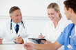 © peopleimages.com - Doctors, writing and meeting with people in hospital for patient treatment plan, consulting and healthcare. Diagnostic advice, medical board and nurse with team in clinic for test results and review