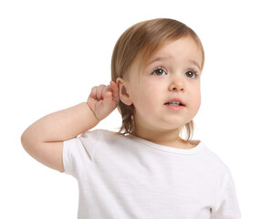 Wall Mural - Cute little baby girl showing her ear on white background