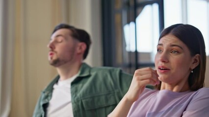 Wall Mural - Involved pair watching horror movie at home closeup. Nervous couple looking tv