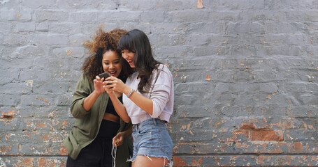 Poster - Wall, women and friends with smartphone, showing or excited for acceptance to college or notification. Joy, wow and student with results for application, success and email for registration to school