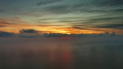 Wall Mural - aerial view of sea surface during a beautiful colourful sunset, timelapse, 4k