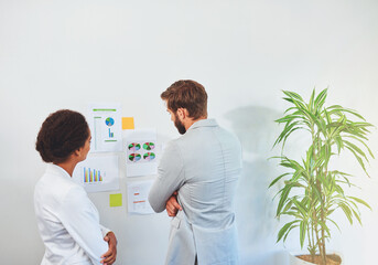 Poster - Data, documents and wall with business people in office for analysis of social media traffic. Collaboration, statistics or thinking with man and woman employee in marketing agency for planning