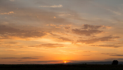 Wall Mural - Sunset over the Balkans. The stillness and the dusk. Cirrus clouds in a crimson sky.