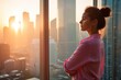 © Fred - Lady wearing white shirt staring at sunset above urban skyline