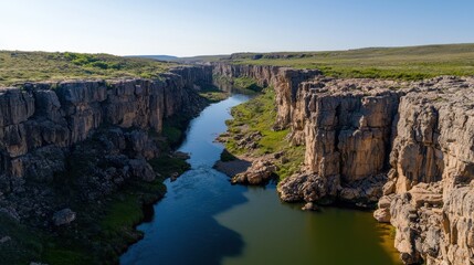 Poster - A scenic view of a river cutting through a rocky canyon, high clarity