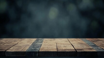 Wall Mural - Rustic wooden table with dark blurred background, ideal for food photography or product display