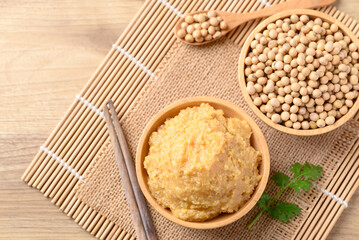 Wall Mural - Miso paste in wooden bowl, Japanese seasoning made from fermenting soybeans with salt, Traditional food ingredient in Japanese cuisine