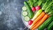 © PB Studio - colorful array of raw vegetables like carrots, cucumbers, and radishes on a white plate. Copy space on the left. Healthy meal preparations