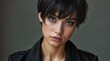 © Daniel L - Close up portrait of a woman with a radiant, flawless complexion promoting skin care and cosmetsics. Black hair. She is wearing a black shirt with shoulder tabs.