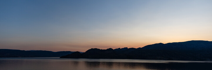 Wall Mural - panorama beautiful sunrise scene over a tranquil Okanagan lake British Columbia Canada