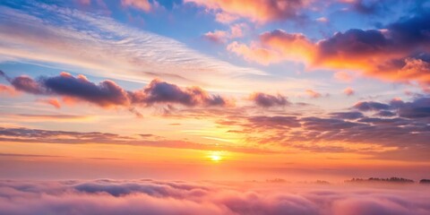 Wall Mural - Soft pink hues of sunrise peeking through thin clouds on a serene morning sky