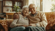 © Margarita - Elderly Couple Hugging on Couch for Family Blogs, Senior Living Promotions, and Relationship Counseling Resources