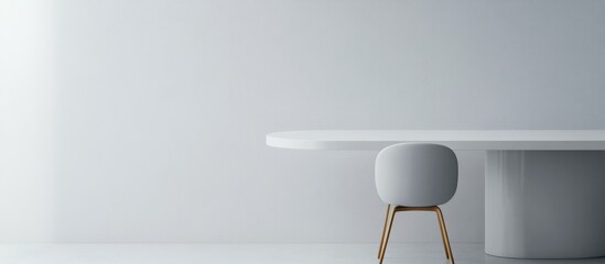 Poster - Minimalist modern interior with white table and chair against light gray wall featuring copy space for text placement