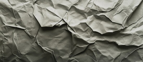 Poster - Crumpled textured paper background in shades of green with natural shadows and highlights ideal for design projects Copy Space