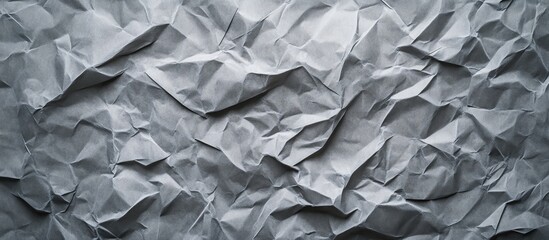 Poster - Crinkled texture of gray paper background with visible creases and folds Copy Space