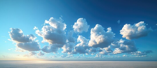 Poster - Clouds in a blue sky during daylight with a clear horizon and expansive view Copy Space