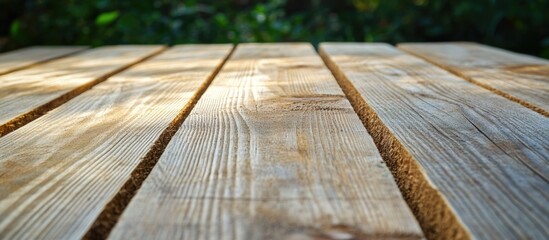  - Wooden texture with parallel planks on a table surface natural background with blurred greenery Copy Space