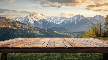 Poster - Wooden table with scenic mountain landscape background and clear sky at sunset