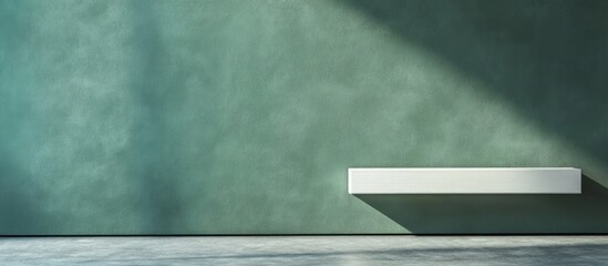 Aufkleber - Minimalist interior with green textured wall and white shelf casting a shadow in natural light Copy Space