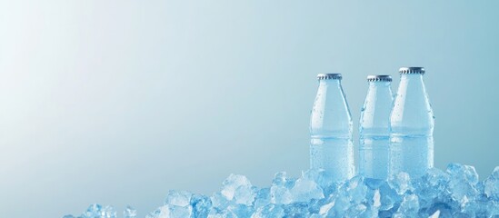 Poster - Three clear water bottles on a bed of ice with a soft blue background and ample copy space for text placement.